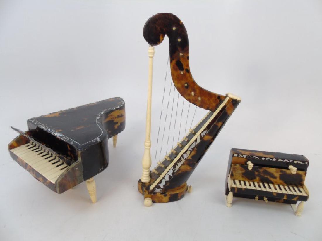 3 Miniature Instruments in Tortoise Shell & Bone: 3 Miniature Instruments in Tortoise Shell & Bone, grand piano, upright piano, and harp. Intricate detail of drop keyboard covers, feet & pedals, and inlaid trim. Harp measures 8.5 x 4.5 inches.