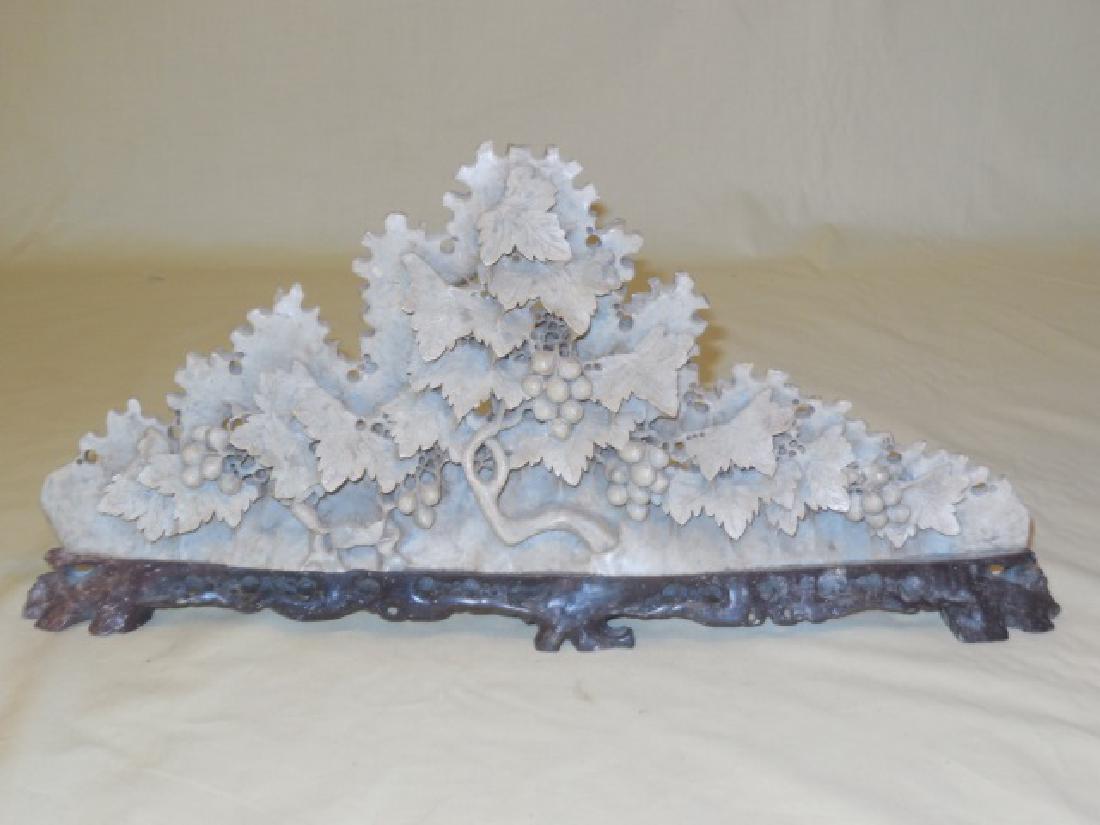 Carved Soapstone Grape & Leaves Sculpture on Stand: Carved soapstone grape and leaves sculpture on wood stand. 14 3/4" W x 1 1/2" D x 7" H. In very good condition. Shipping available within the Continental USA (excludes insurance) $45.00