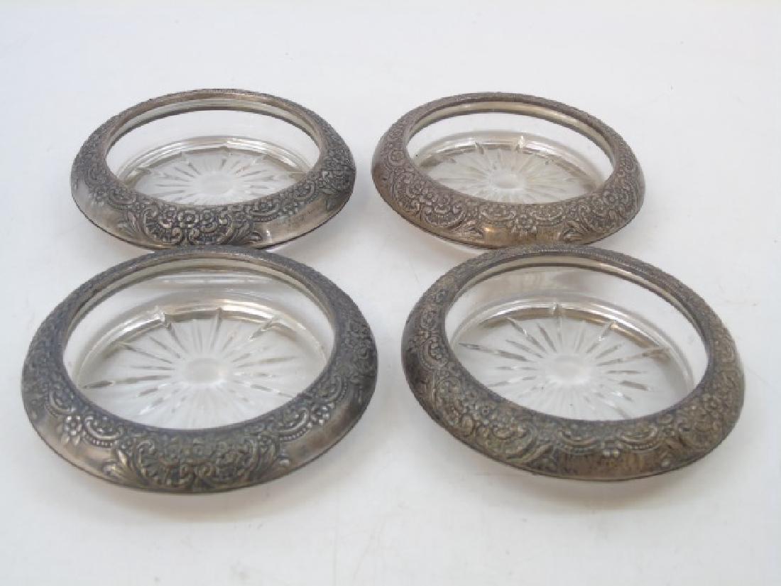 Four Vintage Sterling Silver Border Coasters: Four Vintage Sterling Silver Border Coasters. Hallmarked. Measures 4 inches in diameter. Having repousse borders and starburst centers.