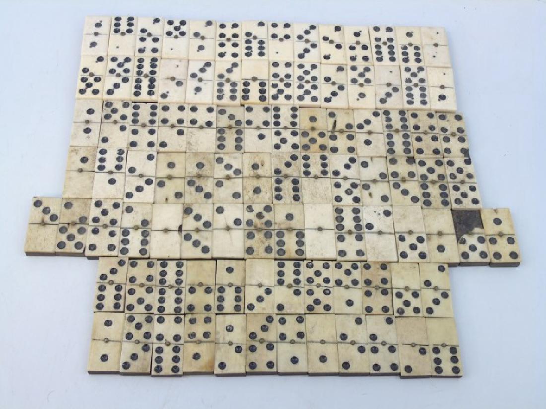 Antique 19th C Ebony & Bone Set of Dominoes: Antique 19th C Ebony Tone Wood Carved Bone Set of Dominoes. Each measures 1.75 inches in length.