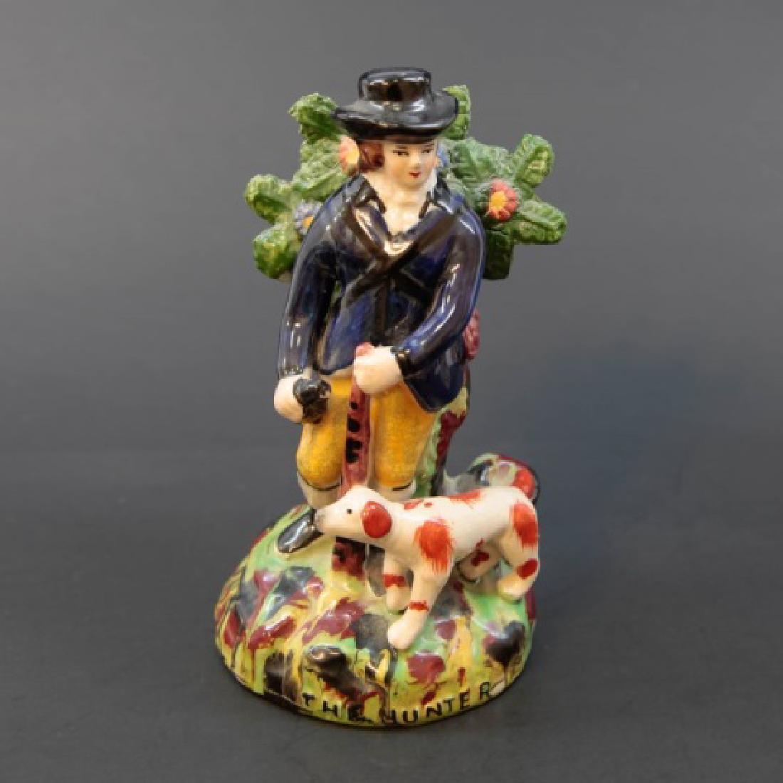 Antique Staffordshire Style Statue "The Hunter": Antique Staffordshire Style Statue "The Hunter" of Man w Dog. Hand painted. Measures 7 inches in height. Possibly by Kent.