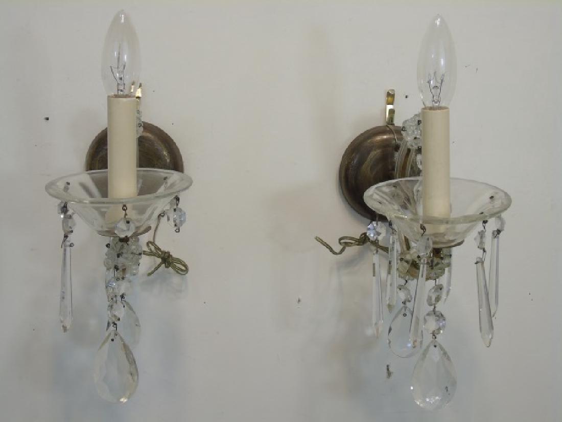 Pair of Crystal Teardrop & Bronze Accent Sconces: Pair of Crystal Teardrop & Bronze Accent Sconces with crystal cups beneath lights. Each measures 11 x 5 x 9 inches.