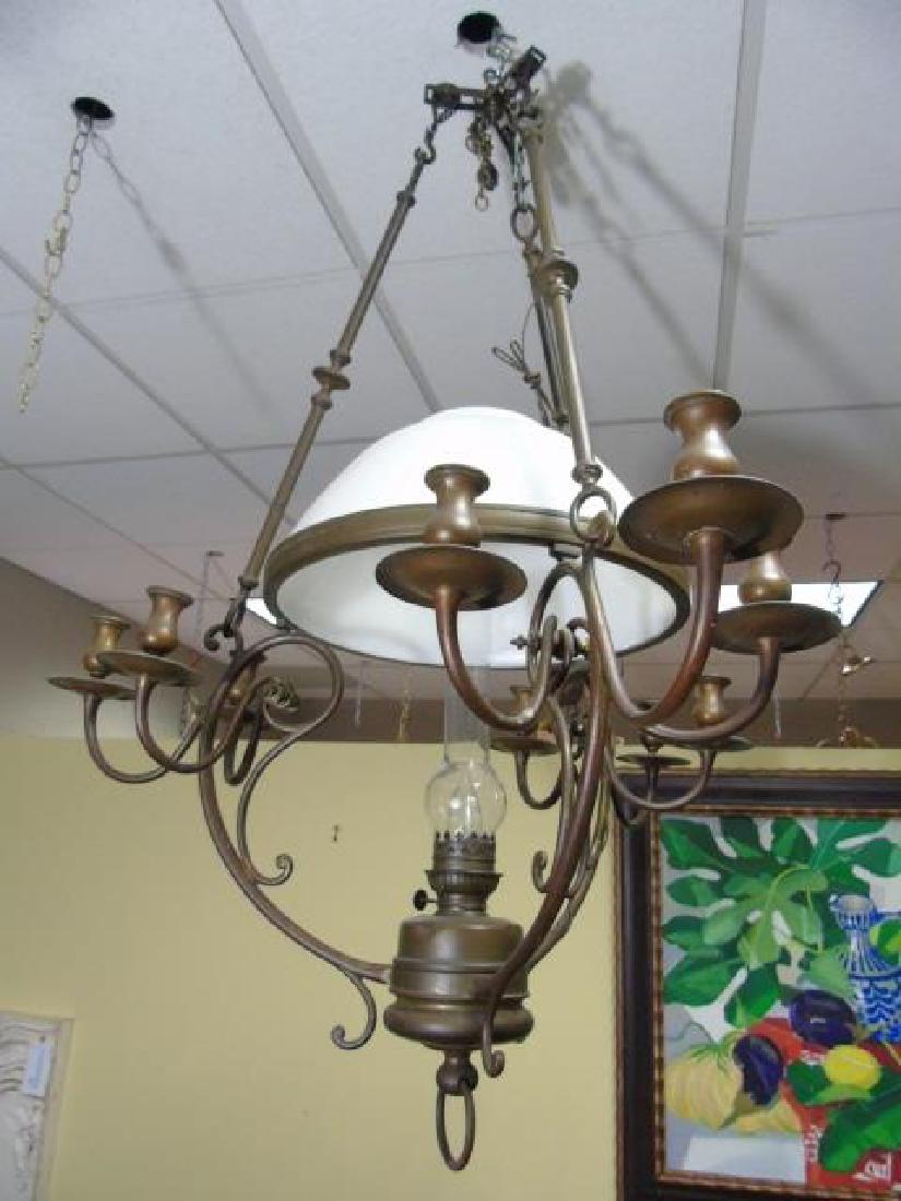 Early American Antique Rubbed Bronze Lantern: Early American antique Rubbed Bronze Lantern with white glass. Has central white glass domed light and 3 triple light arms, 9 lights in total. Measures 51 x 44 inches.