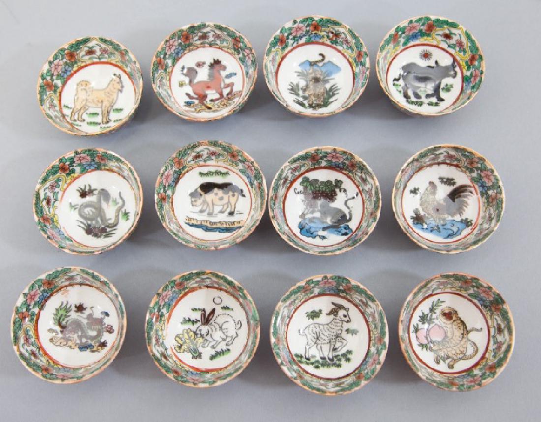 Set Of 12 Chinese Porcelain Zodiac Tea Cups: Set of 12 Chinese Porcelain Zodiac Tea Cups. Each measures 2 inches in diameter.
