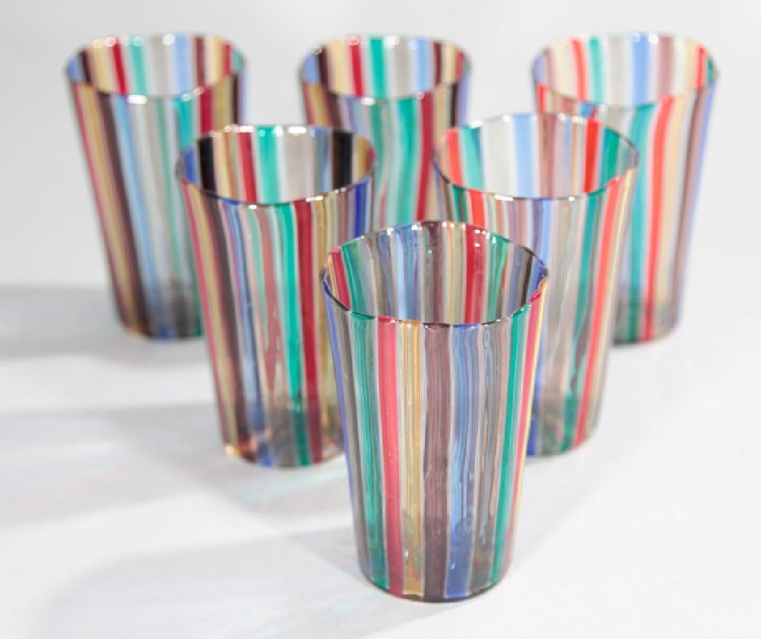 Six Murano Venini Art Glass Highball Tumblers: Set of Six Murano Venini Art Glass Highball Tumblers. Each blown glass with pontil mark on bottoms, striped pattern. Apparently unmarked. In the style of / attributed to Venini. Each measures 4.75 inc