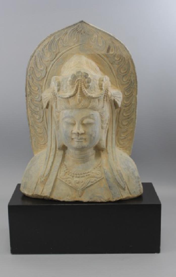 Large Chinese / Asian Female Buddha Bust Statue: Large Chinese / Asian Female Buddha Bust Statue on Custom Made Black Painted Pedestal Base. Carved stone, with painted patina surface. Well detailed. Measures 32 x 20 x 9 inches.