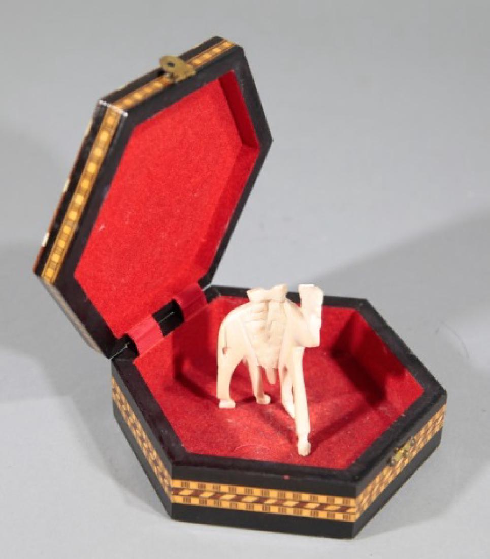 Carved Camel Bone Statue & Inlaid Moroccan Box: Carved Camel Bone Statue & Inlaid Moroccan Box. Statue of a camel and inlaid wood and bone box that measures 5.5 inches wide.