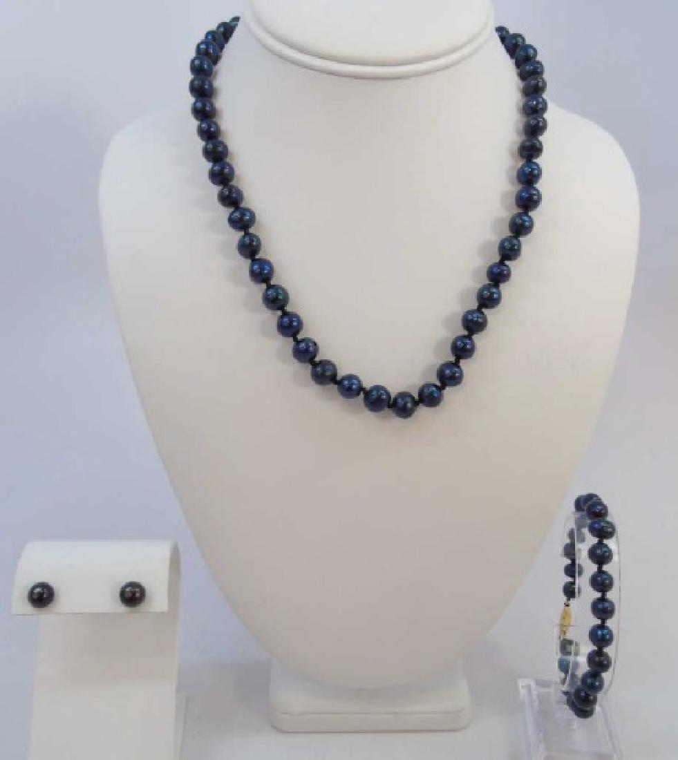 Tahitian Style Black Baroque Pearl Jewelry Suite: Tahitian Style Black Baroque Pearl Jewelry Suite. Necklace, bracelet and earrings with filigree gold tone clasps. Necklace measures 17 inches in length.