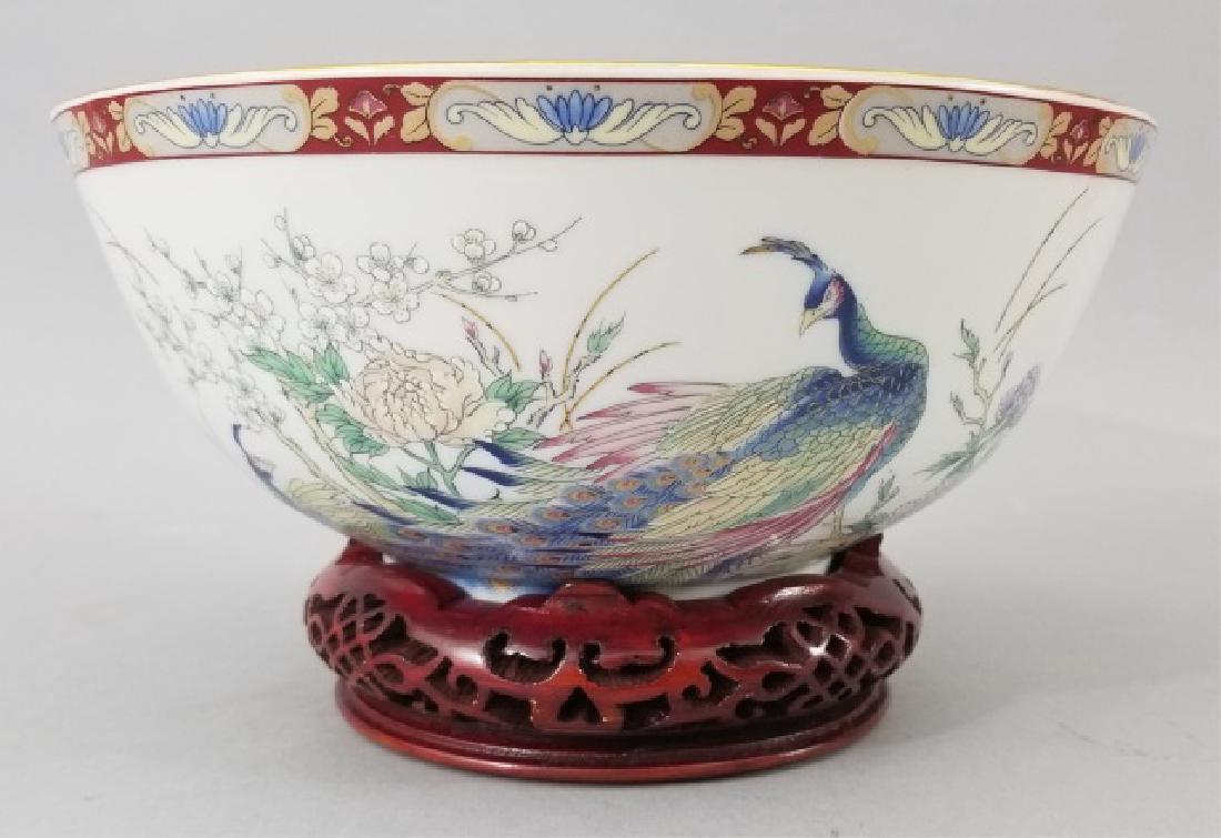 Vintage Japanese Porcelain Bowl on Carved Stand: Vintage Japanese Floral Porcelain Bowl on Carved Wood Stand. Having a central medallion with a beautifully painted realistic peacock, as well as other peacocks on the outside walls of the bowl. Measur