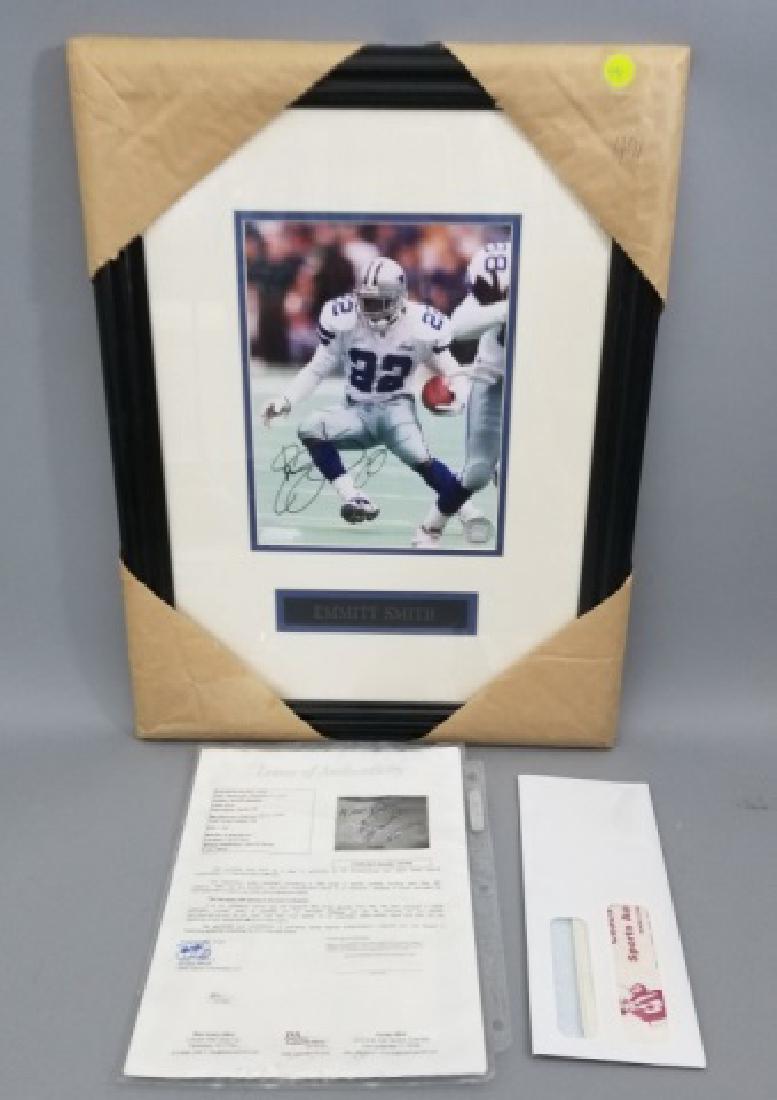 Framed Signed Emmitt James Smith NFL Photograph: Framed Signed Emmitt James Smith NFL Photograph. Measures 21 x 16 inches.