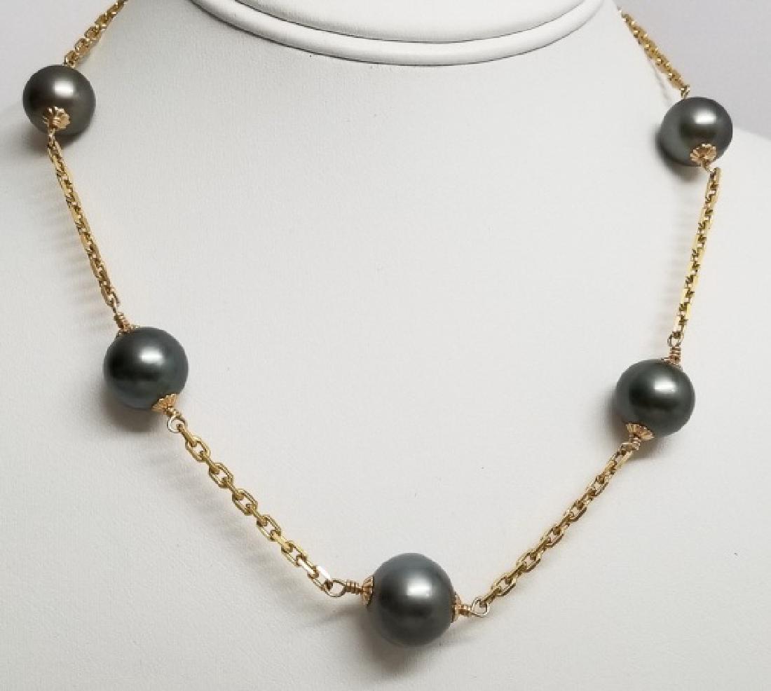 14kt Yellow Gold & Tahitian Pearl Necklace Strand: 14kt Yellow Gold & Tahitian Pearl Necklace Strand. Hallmarked 14kt and Italy. Set with five Tahitian pearls. Measures 16.5 inches in length. Pearls are approximately 12 mm. Weighs approximately 24 gra