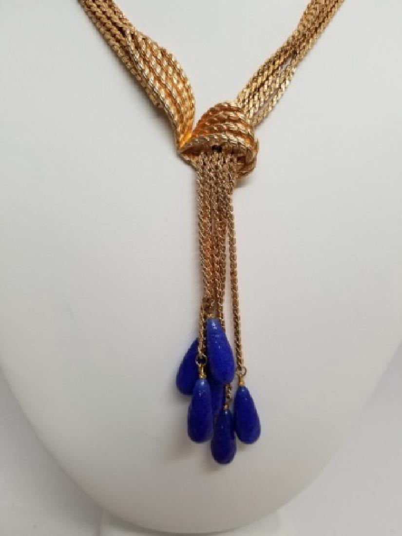 Multi-Strand Gilt Necklace with Lapis-Tone Tassels: Multi-Strand Gilt Necklace with 6 Lapis-Tone Tassels, having a pass-through elegant design. Circa 1960 and attributed to Kramer. Measures 15 inches.