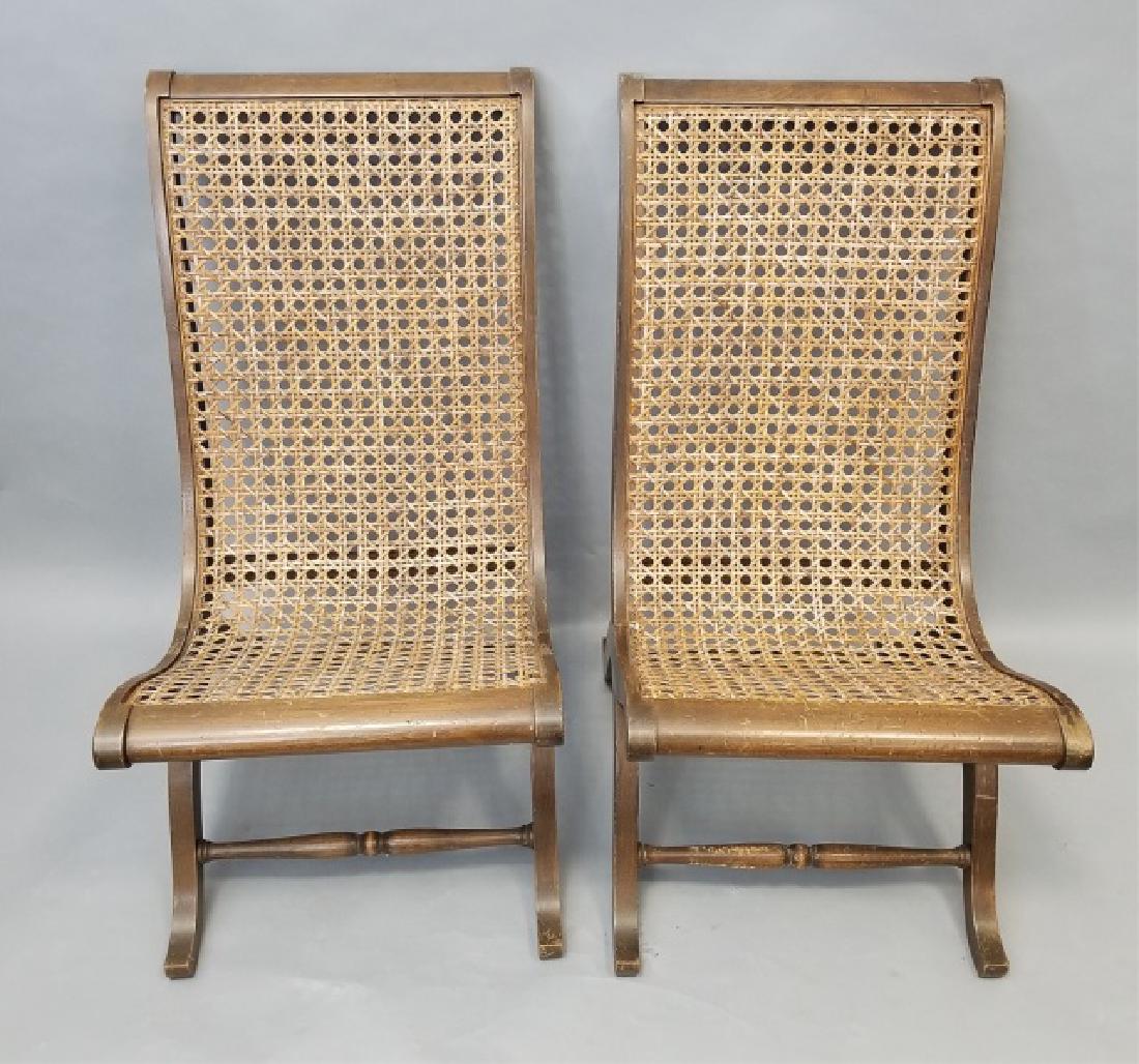 Pair Plantation Style Carved & Caned Slipper Chair: Pair Plantation Style Carved & Caned Slipper Chairs. Each measures 34 x 18.5 x 24 inches.