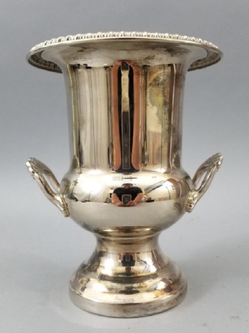 Silver Plate Wine Cooler in Classical Urn Shape: Silver Plate Wine Cooler in Classical Urn Shape with Handles. Measures 9 inches tall.