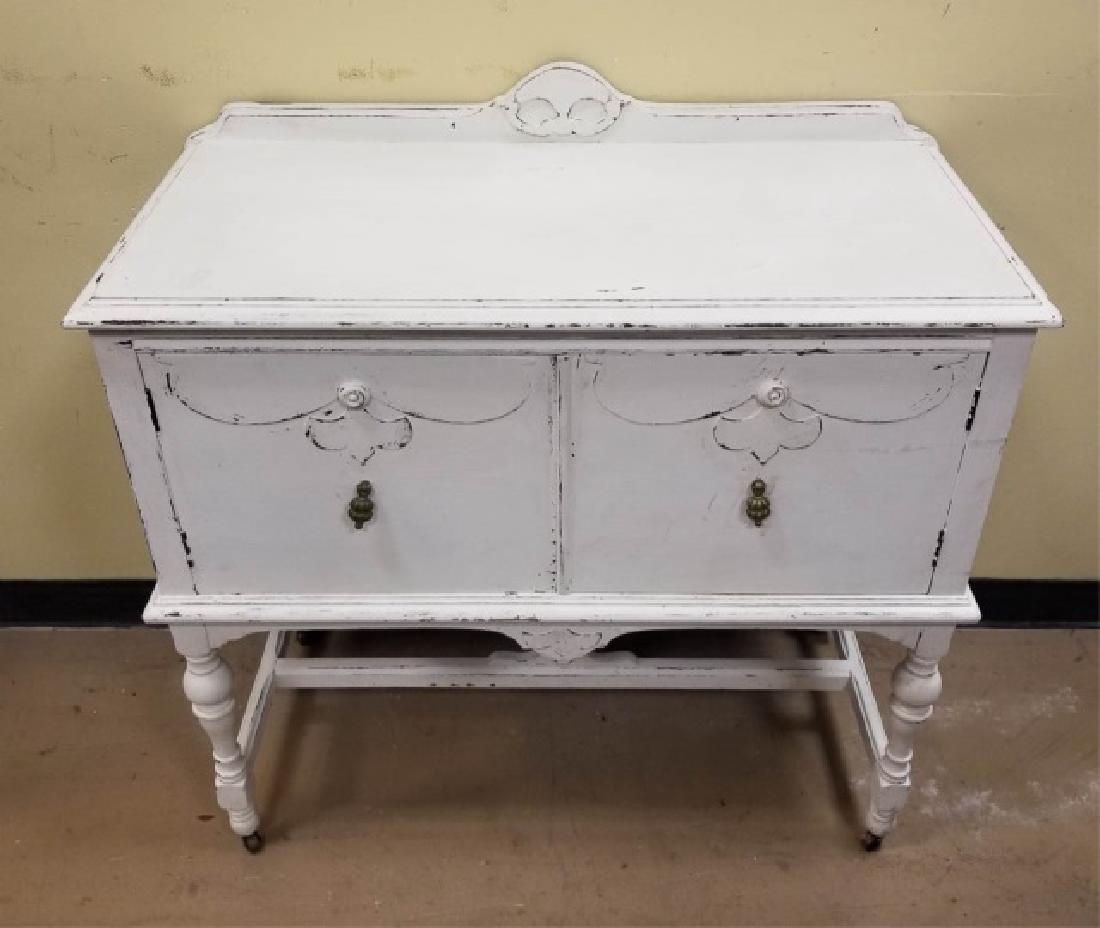 Contemporary Distressed Cream Colored Credenza: Contemporary Distressed Cream Colored Credenza Console with two cabinet doors and pendant brass pulls. Measures 37 x 38 x 18 inches.