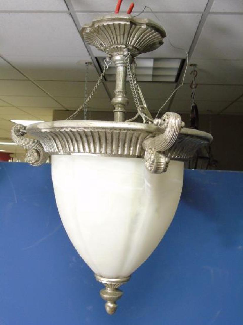 NeoClassical Pewter Tone & White Glass Lantern: NeoClassical style Pewter Tone & White Glass Lantern. Carved detail at top & on the ceiling mount piece. Measures 24" in length.