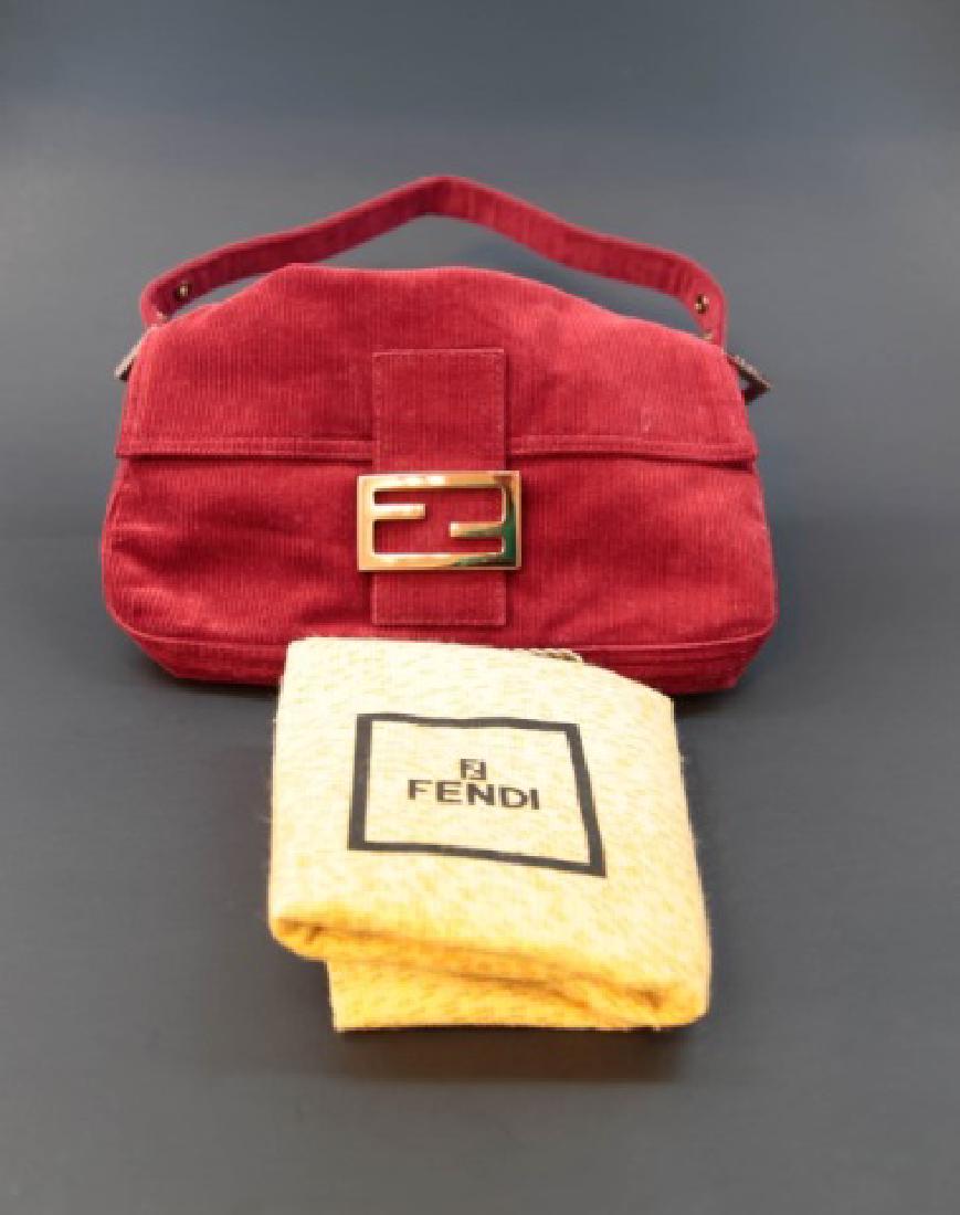 Fendi Brick Red Corduroy Handbag with Fabric Pouch: Fendi Brick Red Corduroy Handbag with Fabric Pouch. Gold hallmarked buckles with adjustable strap. Measures 7 x 10 inches.