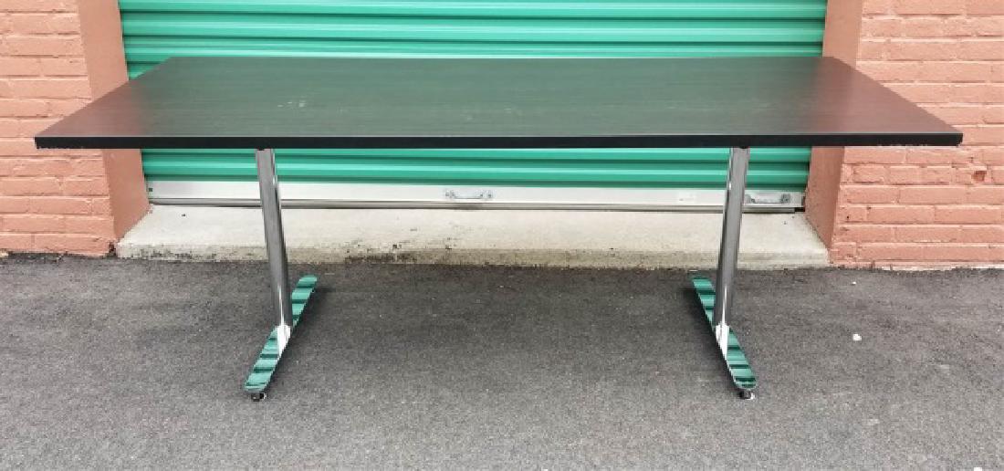 Versteel Brattice Faux Wood-Chrome Table (1 of 5): Versteel Brattice Faux Wood & Dark Chrome Table (1 of 5). Having folding legs. Measures 29.5 x 32 x 78 inches.