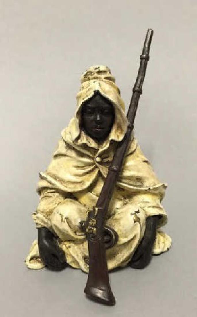 Antique Vienna Austrian Bronze Orientalist Figure: Antique Vienna Austrian Bronze Orientalist Figure. Cold painted antique bronze statue of a moorish / orientalist figure with a rifle. Measures 4.5 inches in height.