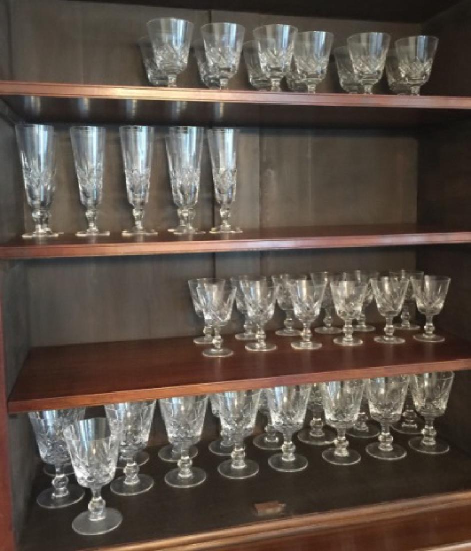 Large Service Finely Cut Stuart Crystal Stemware: Large Service Finely Cut Stuart Crystal Stemware in Four Sizes. Including Champagne flutes, white wine, red wine and water goblets. Each champagne goblet measures 7.25 inches in height.