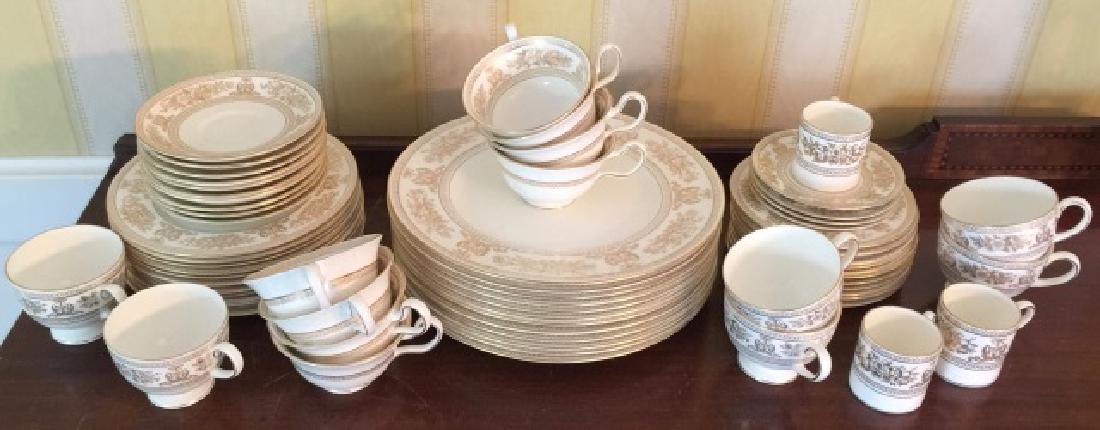 Wedgwood Gold Columbia English Porcelain Service: Wedgwood Gold Columbia English Porcelain Dinner & Dessert Service. Dinner plates, salad /luncheon plates, cake plates, cups and saucers. Marked on bottoms. Each dinner plate measures 10.75 inches in d