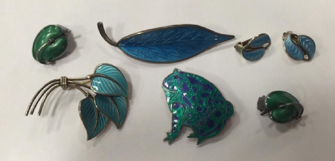 Group of Sterling & Enamel Figural Norway Jewelry: Group of Sterling & Enamel Guilloche Figural Norway and Denmark Jewelry, all hallmarked for various makers (Meka, David Anderson, Hans Myhre, and Rudolph Billing) and 925 for sterling. Included are 2 