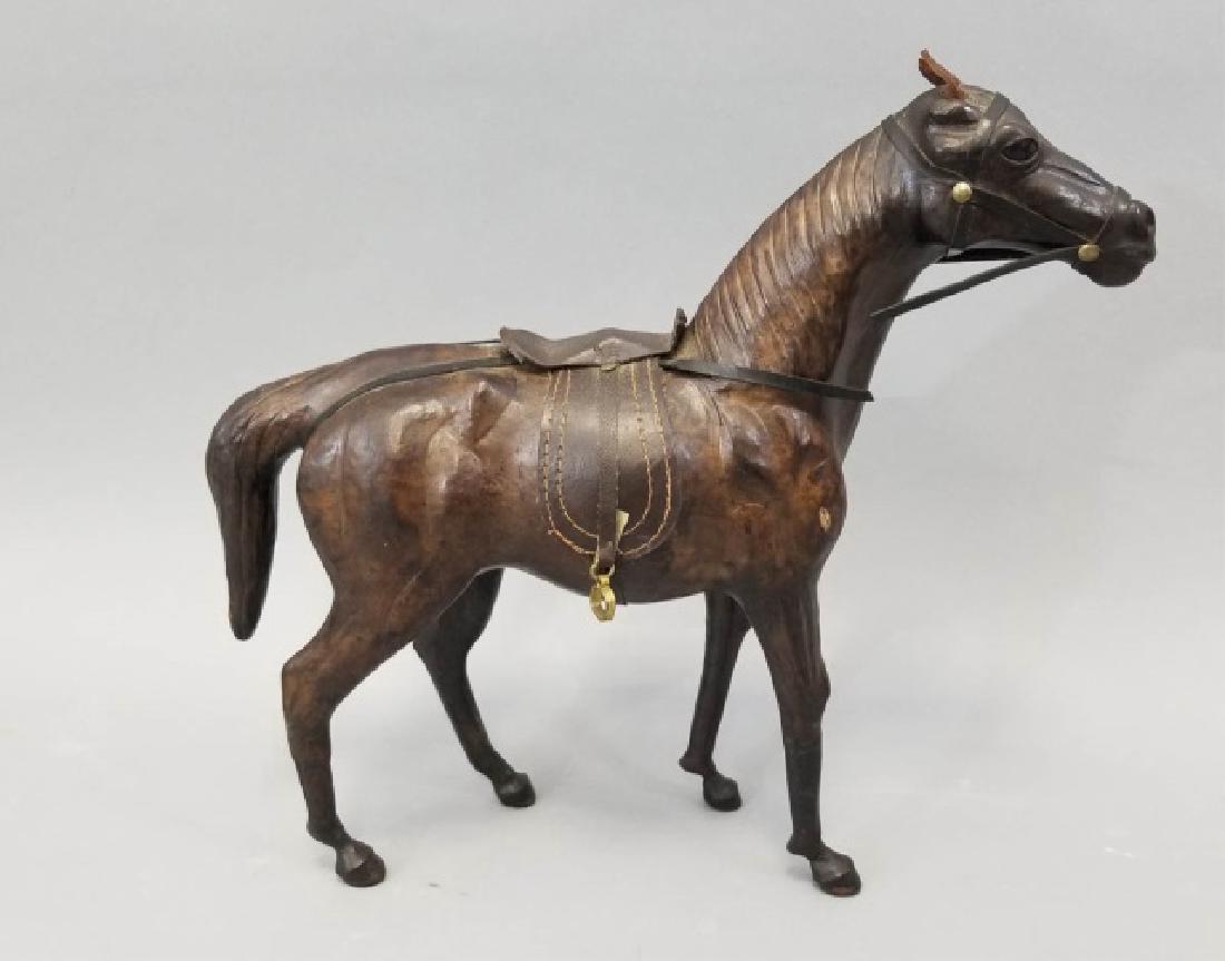 Handmade Leather Equestrian Statue of a Horse: Handmade Leather Equestrian Statue of a Horse. Nicely molded and detailed. Has glass eyes. Measures 13 x 14 x 4 inches.