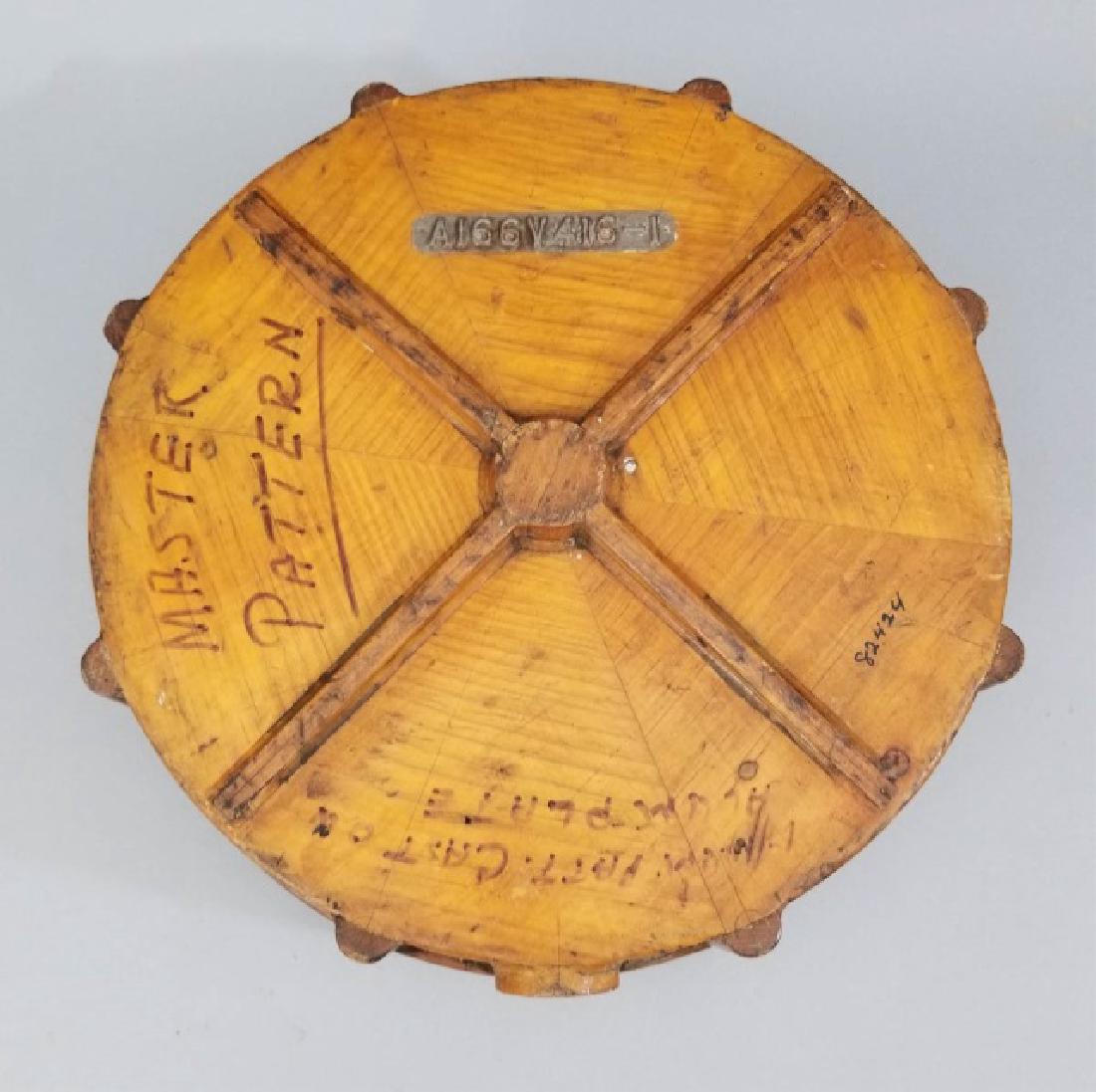 Antique Wooden Industrial Steel Mold Wheel Shape: Antique Wooden Industrial Steel Mold Mid Century Decorative Wall Plaque. Shaped a bit like a wheel with Spokes. Metal form number in front and hand-written words as well. Measures 4.5 x 13 inches.