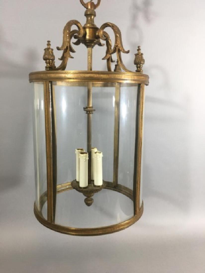 Contemporary Neo Classical Lantern Chandelier: Contemporary Neo Classical Lantern Chandelier. Ormolu metal framework with glass panels. Measures 24 x 12 inches.