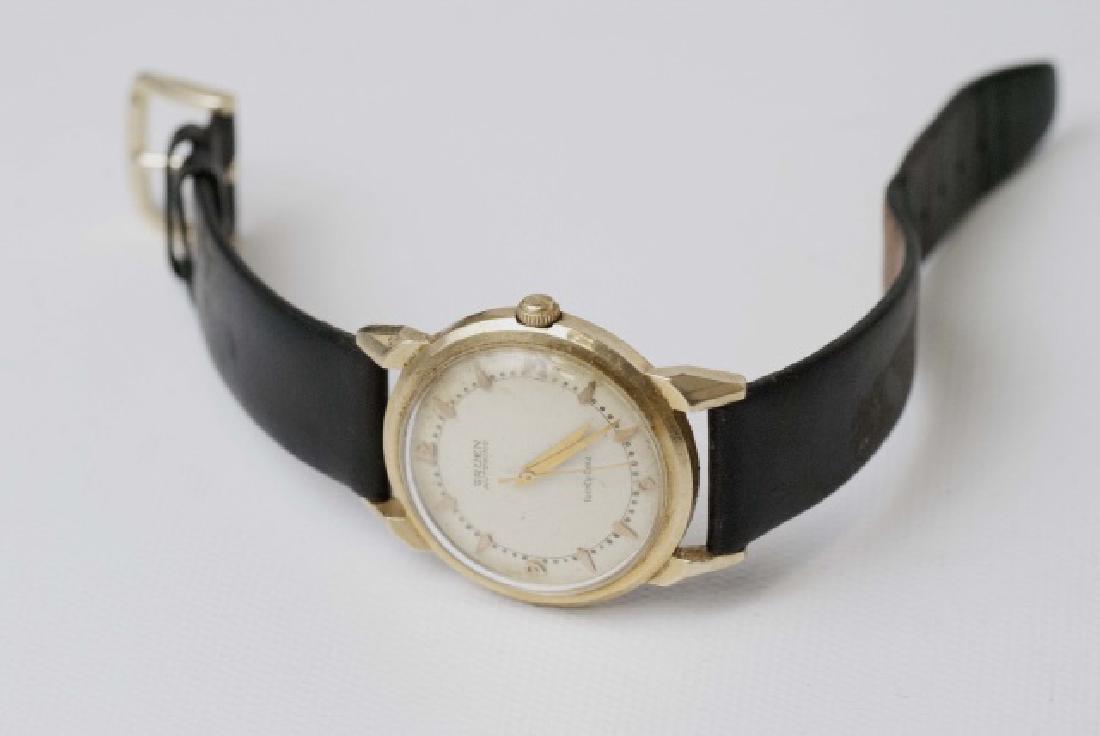 Estate Gruen Autowind 14kt Yellow Gold Watch: Estate Gruen Autowind 14kt Yellow Gold Watch. On leather band. Signed face, hallmarked case. Measures 9 inches in length.