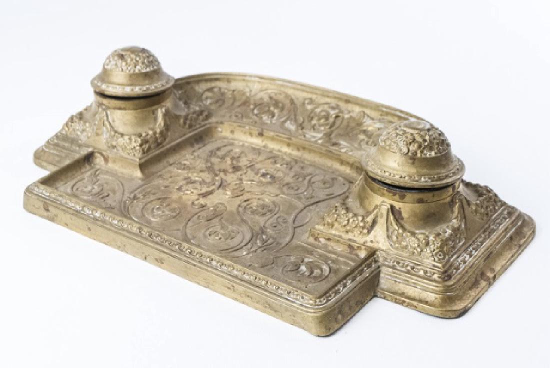 Antique 19th C Victorian Ormolu Double Inkwell: Antique 19th C Victorian Ormolu Double Inkwell. Ornate scrollwork design motif. Measures 14 x 7 inches.