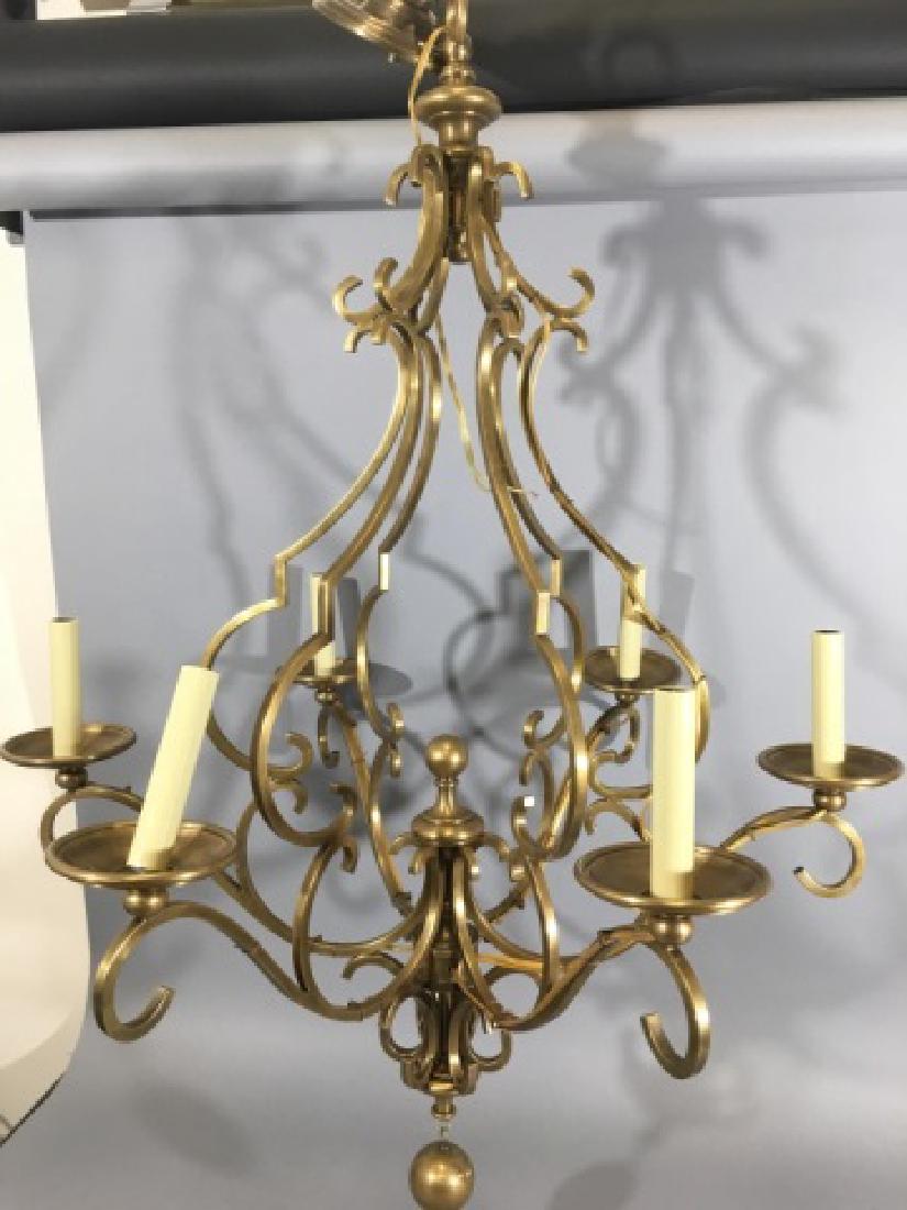 Contemporary Designer Ormolu Finish Chandelier: Contemporary Designer Ormolu Finish Chandelier. With a gilt bronze tone / ormolu finish, six arms and a scrollwork design. Purchased as Klaff's. Measures 39.5 x 31.5 inches.