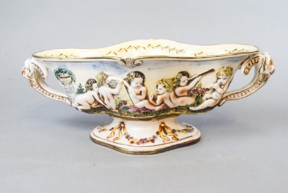 Italian Capodimonte Pottery Centerpiece Urn: Italian Capodimonte Pottery Centerpiece Urn. Signed. Measures 15 inches in width.