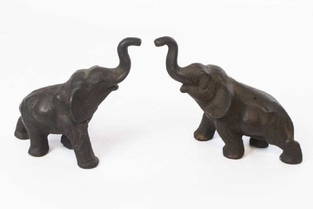 Pair Metal Elephant Statues with Upturned Trunks: Pair of Metal Elephant Statues with Upturned Trunks. Measure 5 x 6 inches each.