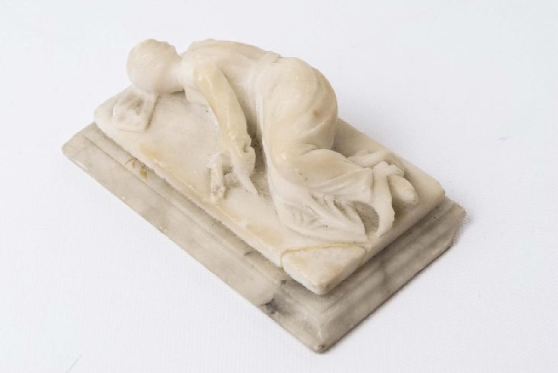 19th C Marble Reclining Figurine: 19th C Marble Reclining Figurine. Having a chip at one corner. Measures 4.5 x 3 inches.