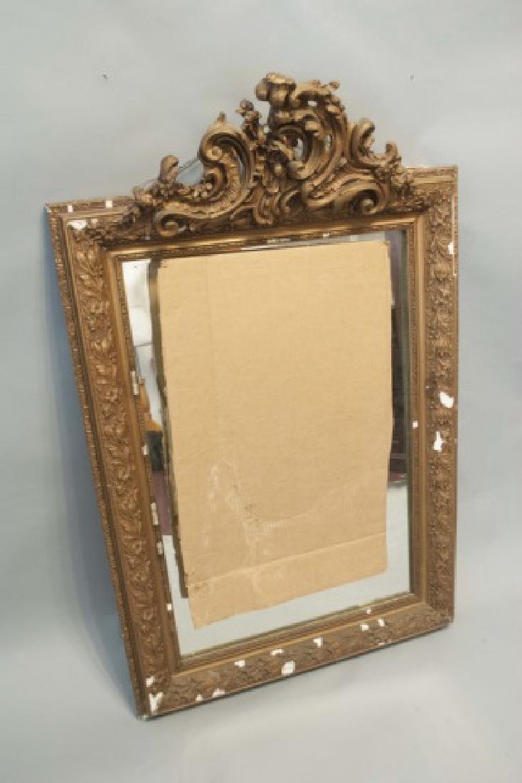 Antique Gilt Gesso Ornately Carved Wood Mirror: Antique Gilt Gesso Ornately Carved Wood Mirror. Needs repair but pieces are included. Measures 48 x 31 inches.