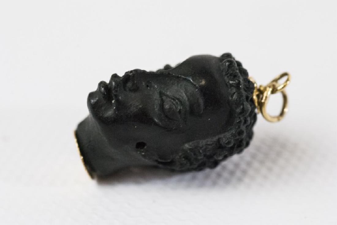 Italian 18kt Gold Blackamoor Pendant by Corletto: Estate Italian 18kt Gold Blackamoor Pendant by Corletto. Hand carved ebony tone wood. Hallmarked Measures approximately 1 inch with loop.