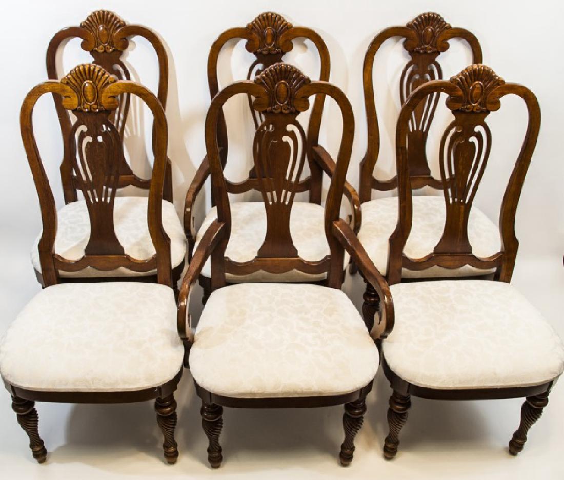 Six Mahogany Tone Chippendale Style Dining Chairs: Six Mahogany Tone Chippendale Style Dining Chairs. Carved mahogany tone frames with upholstered seat cushions. 45 x 18 x 17 inches.