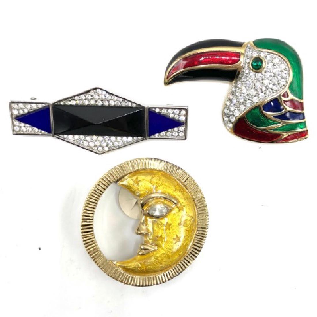 Vintage Trio of Costume Jewelry 80s Pins: Vintage Trio Costume 80s Pins â€“ Set of three designer pins one with enamel and crystals set in gold tone metal in the form of a parrot, another with enamel and crystal signed illegibly in the f