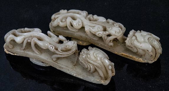 Pair Antique Chinese Jade Dragon Buckles w Tray: Pair Antique Chinese Jade Dragon Buckles w Tray. Two hand carved dragon motif buckles which both test as Nephrite on the Presidium. These two buckles both have a round clasp and each have two sets of