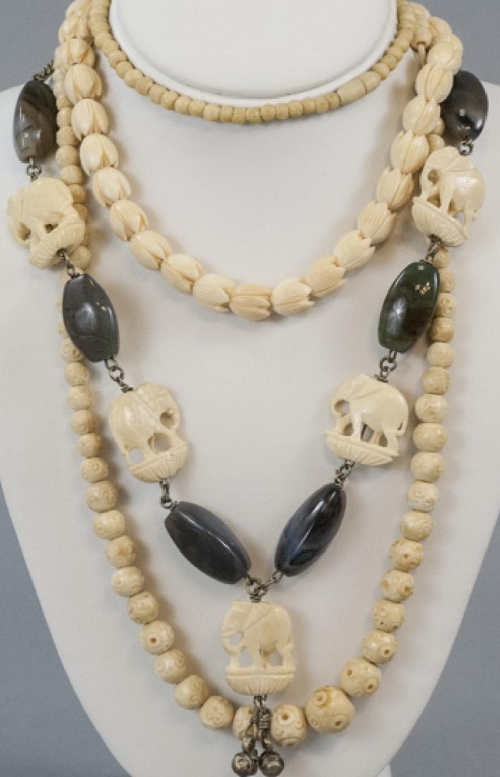 Three Estate Hand Carved Bone Asian Necklaces: Three Estate Hand Carved Bone Asian Necklaces. Hand carved cow or ox bone. One also set with tumbled stone beads and measures 22 inches in length plus pendant.