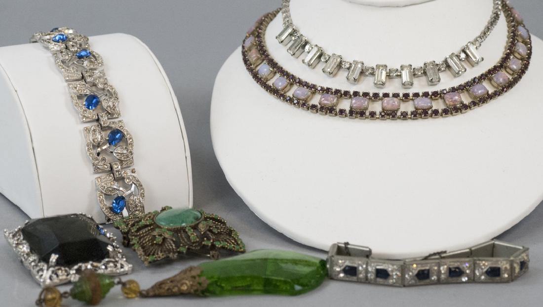 Group of Vintage Rhinestone Costume Jewelry: Group of Vintage Rhinestone Costume Jewelry. Including faux opals, paste rubies, paste topaz, faux jadeite, etc. Floral motif paste sapphire and rhinestone bracelet measures 7 inches in length.