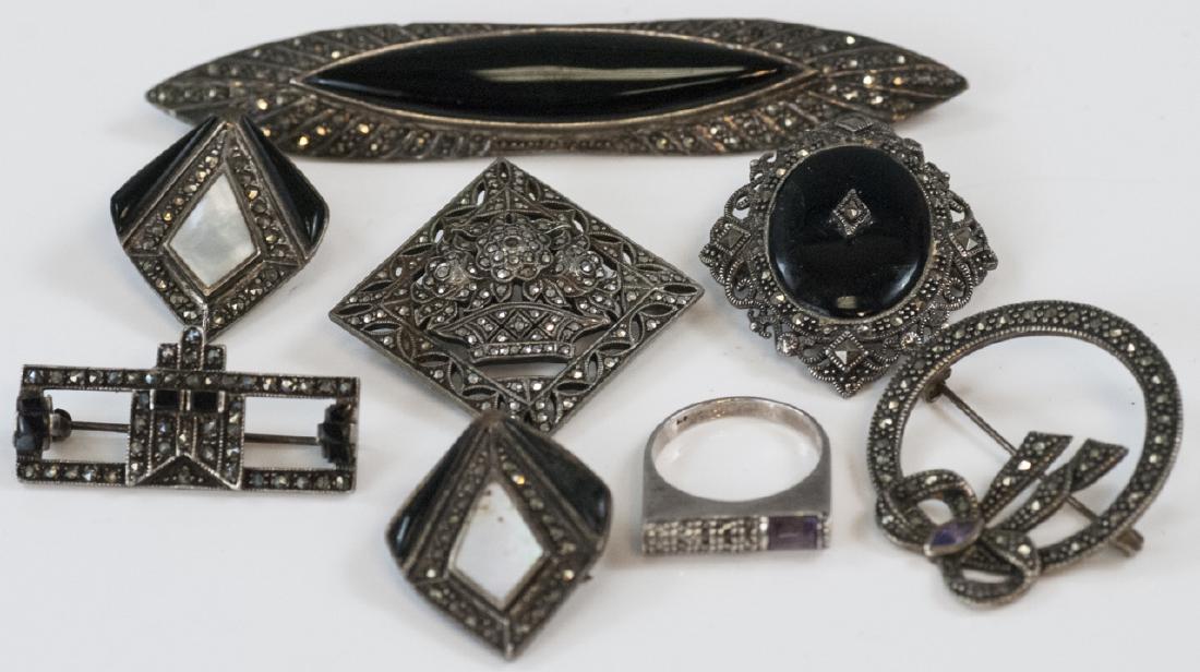 Antique & Vintage Sterling & Marcasite Jewelry: Antique & Vintage Sterling & Marcasite Jewelry. Brooches, pins and clip earrings. Two with onyx. Largest measures 3.75 inches in length.
