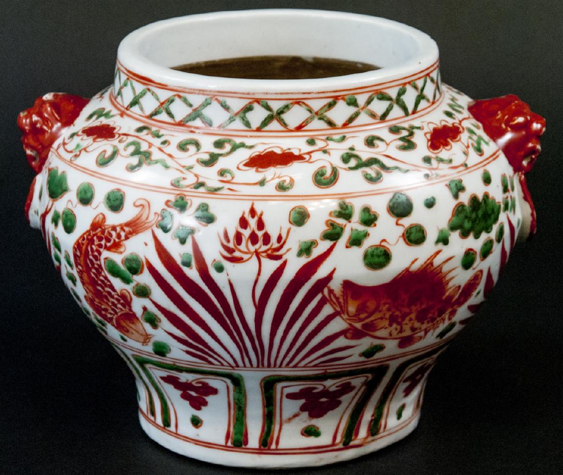 Vintage Asian Porcelain Vase With Fish Design: Vintage Asian Porcelain Vase With Fish Design, this vase features white, red, and green coloring, the fish are in in red, and the background is white, the vase is measured at 7 x 9 inches