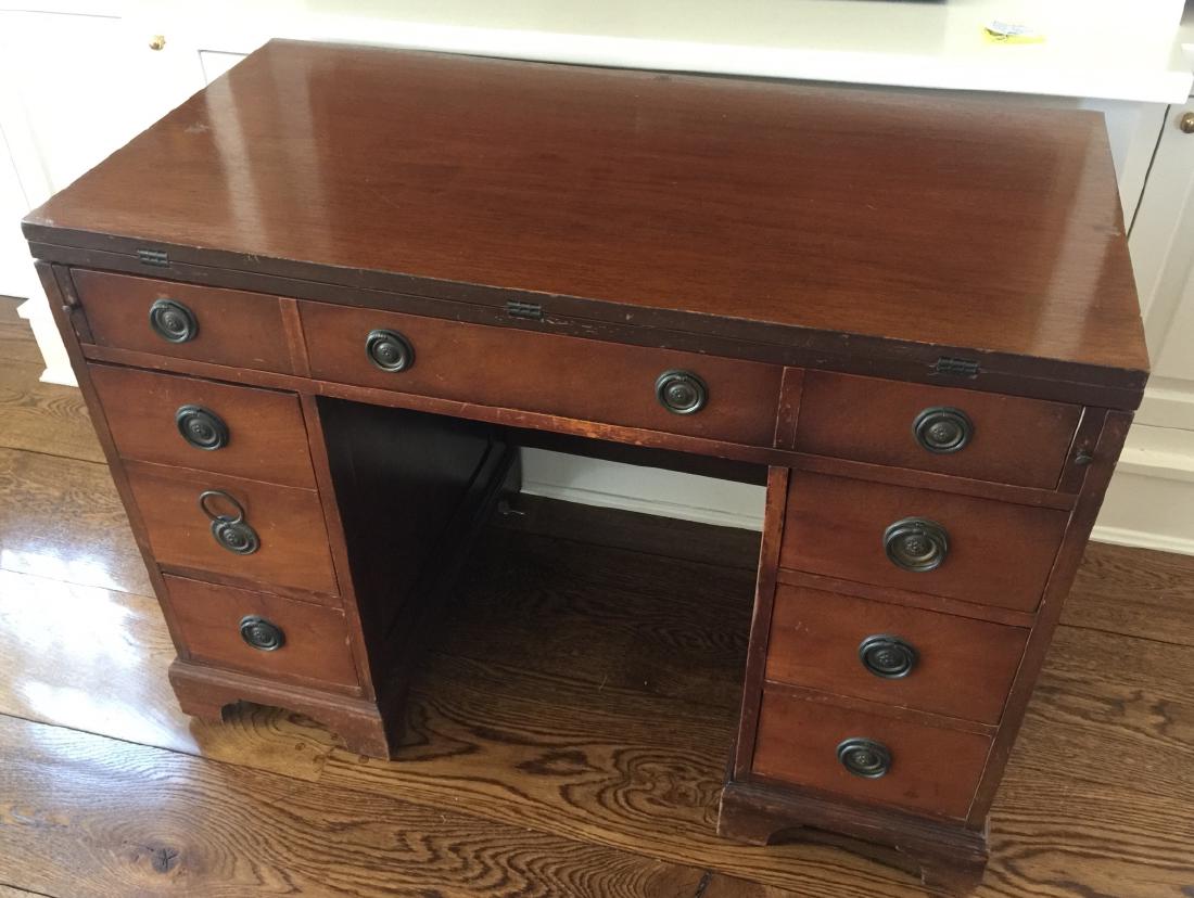 Antique Office Desk Convertible to Dining Table: Antique Office Desk Convertible to Dining Table. Top fold out and supports extend from sides to support leaves. Measures 29 x 41 x 21 inches as a desk, each leaf is 24 inches.