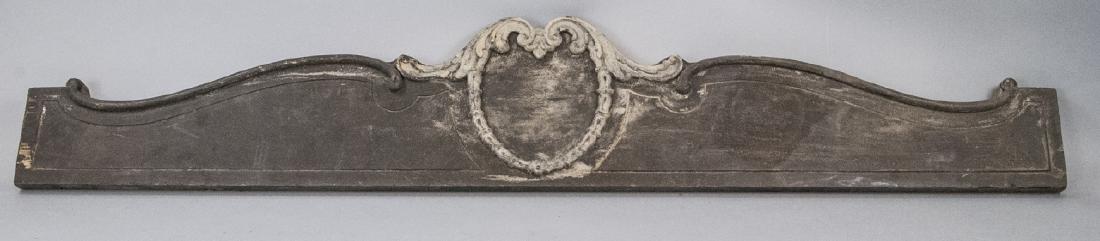 Vintage Decorative Carved Wood Pediment: Vintage Decorative Carved Wood Pediment, this pediment coloring is a worn black, there is a motif in the center of the pediment, the piece is measured at 8 x 44.5 x 1 inches