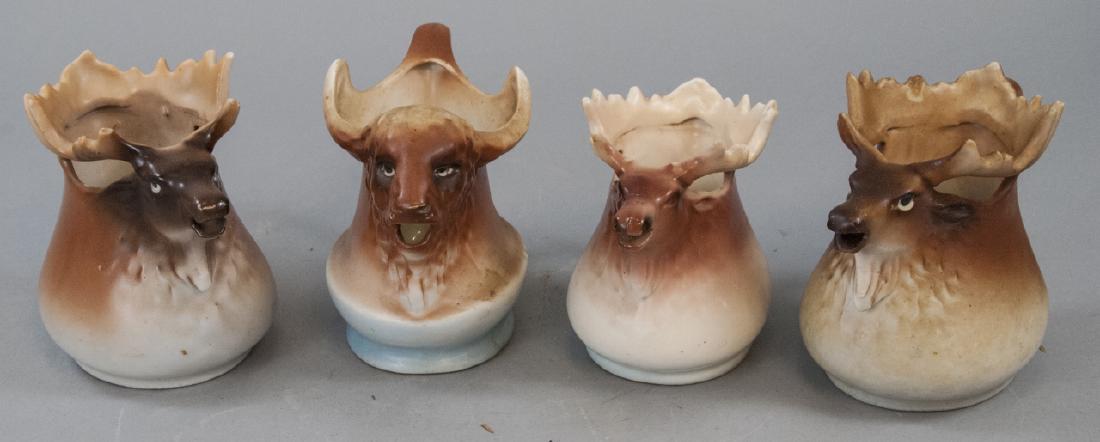 Four Antique Austria & Czech Moose Mugs: Four Antique Austria & Czech Moose Mugs. Marked on bottoms. Hand painted porcelain. Each approximately 4.5 inches in height.