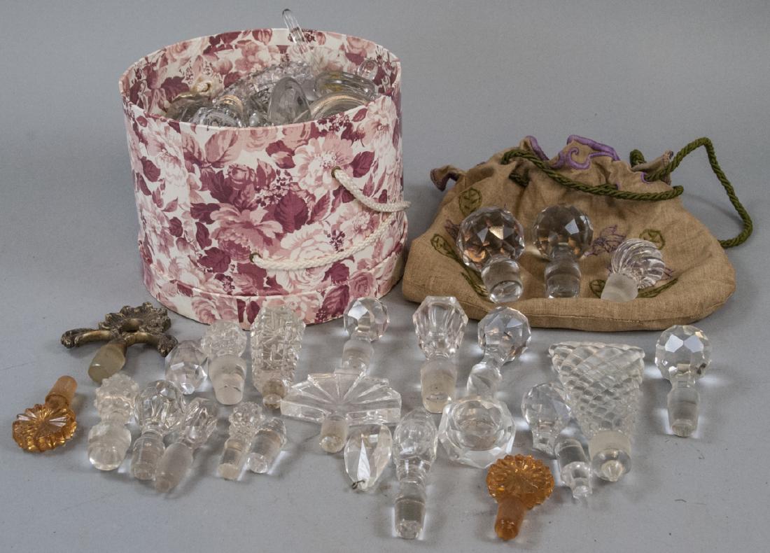 Antique Wine/Decanter/Perfume Bottle Stoppers: Antique Wine/Decanter/Perfume Bottle Stoppers, this lot features a box and bag full of antique wine stoppers, decanters stoppers, and perfume bottle stoppers, the box is measured at 5.5 x 7 inches
