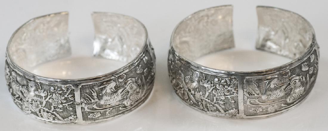 Pair of Chinese / Asian Motif Cuff Bracelets: Pair of Chinese / Asian Motif Cuff Bracelets. Each measures 2.25-2.5 inches across opening. Slightly adjustable.