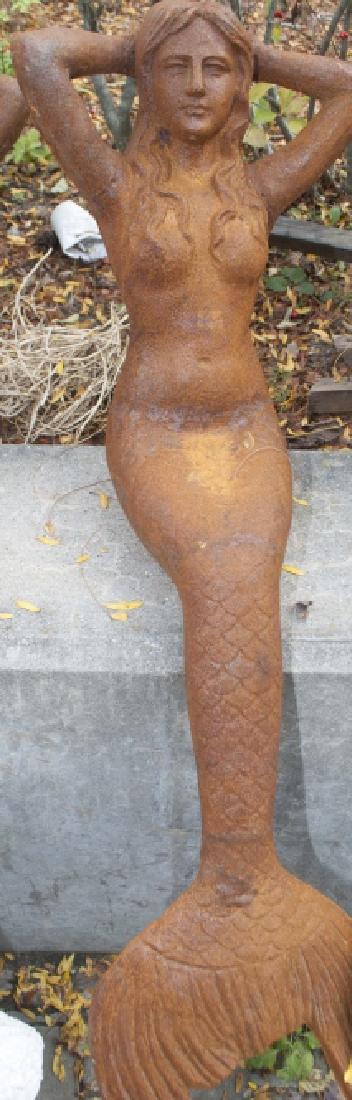 Ornamental Cast Iron Reclining Mermaid: Ornamental Cast Iron Reclining Mermaid; having a waving tail and a Rust Patina. Measures 12 x 41 x 11 inches.